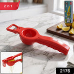 Hand holding the lemon squeezer to extract fresh juice from a lemon.