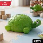 Close-up of coin slot on tortoise money bank