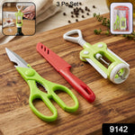 Close-up of the durable stainless steel kitchen knife and multi-purpose scissors from the set.