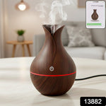 Compact Mini Wooden Humidifier creating a serene ambiance in a modern living space.