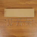 Compact wall mounted hook rack for small spaces
