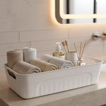 Side view of stackable white plastic storage baskets